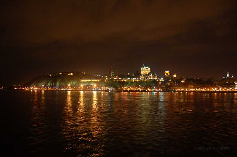 Canada East Tour 2006074.JPG - Quebec City at night, taken from the Quebec City - Levis ferry.  The bright building to the right of center is Chateau Frontenac.  The band of light to the left of Chateau Frontenac is the outside of the Upper Town walls.  The Citadel is at the top of the taller bluff to the left of the Upper Town walls.